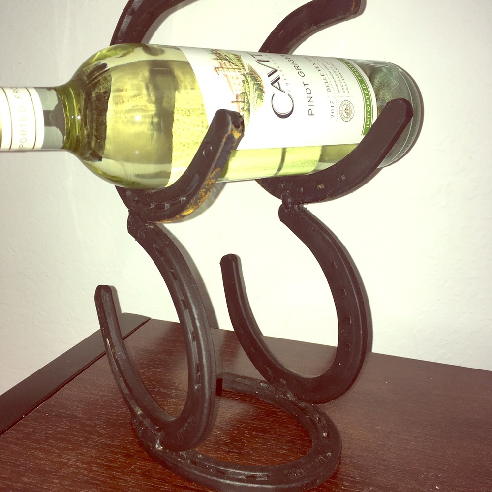 Welded horseshoe wine rack.